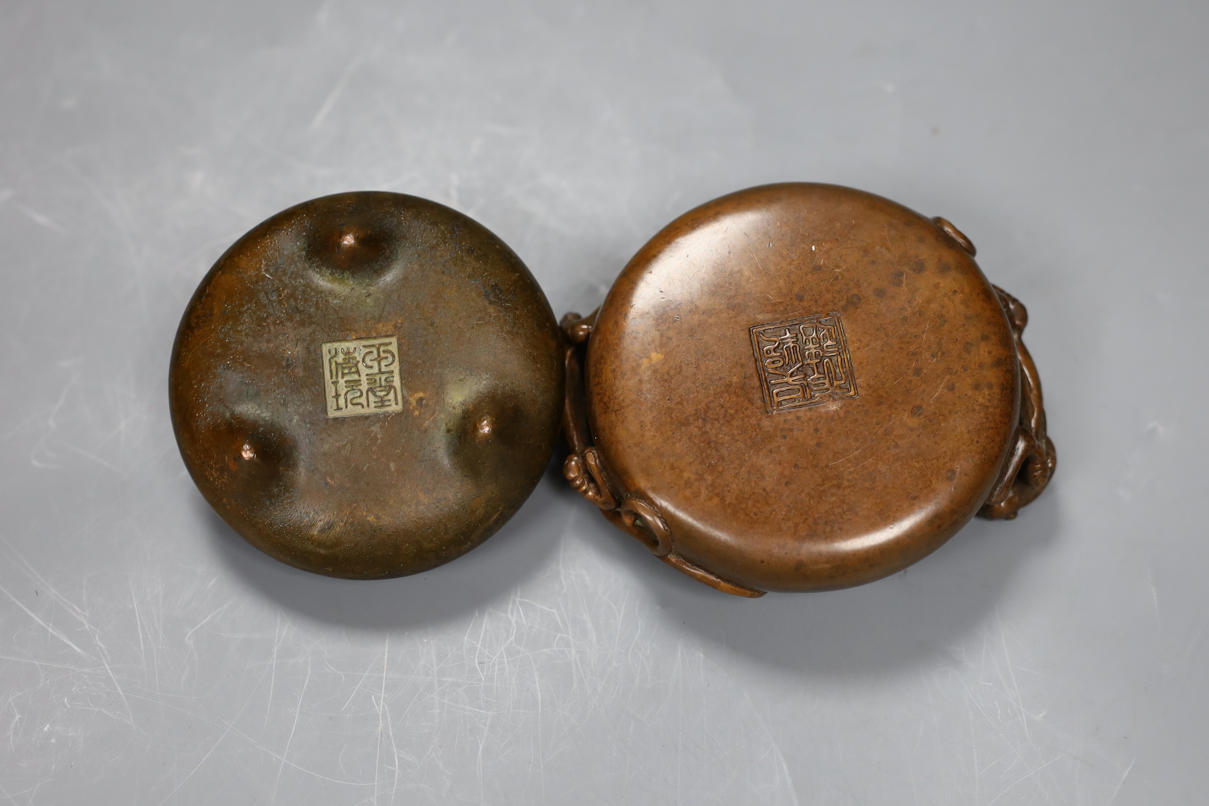 Two Chinese bronze censers, largest 11cms diameter